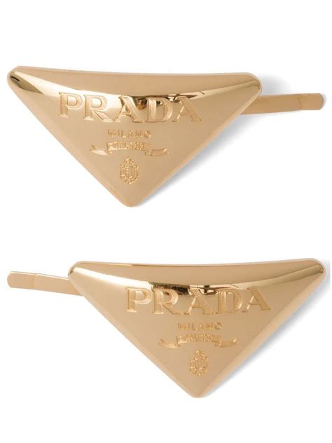 prada head and|prada hair clips.